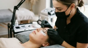 Technician applying lash extensions to a client at a Blacktown beauty salon.